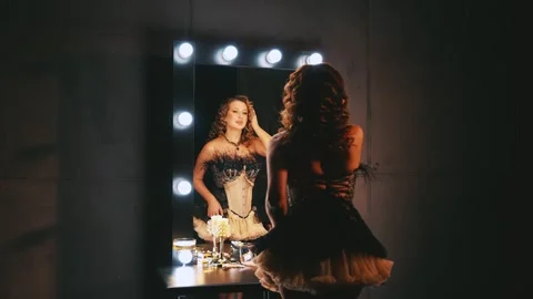 Happy retro lady in short mini dress back rear view looking into mirror Stock Footage 328342178