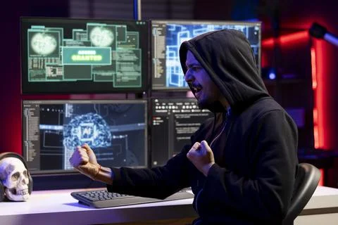 Happy rogue software developer getting access granted message Foto stock