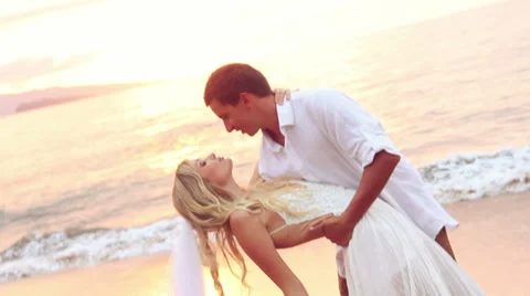 Happy romantic bride and groom, sunset wedding on tropical beach, hd video Stock Footage