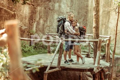 Happy romantic couple being together on the bridge Stock Photos