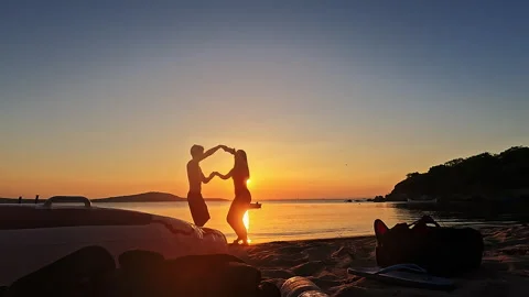 Happy Romantic Couple Dancing At Sunset Beach In Slow Motion Video stock 335699006