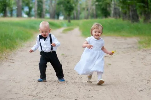 Happy running babies Stock Photos
