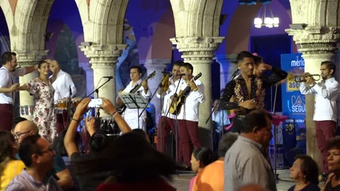 Happy salsa latin dancers performing with a live band outside in Merida, Mexico. Stock Footage