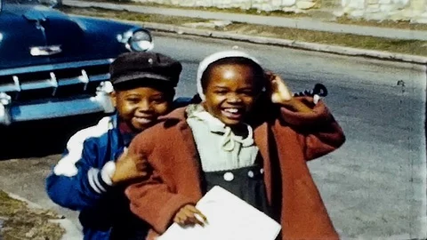 Happy school children walk home after class 1950s family home movie 4836 Stock Footage 89058284