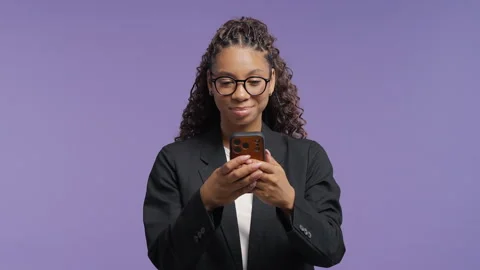 Happy school girl using smartphone with cheerful smile. Mobile technology, messa Stock Footage 341700233