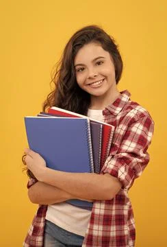 Happy school kid ready to study with workbook, back to school Stock Photos