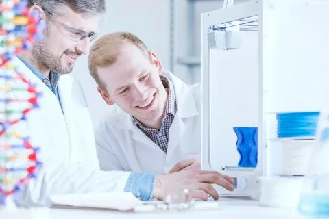 Happy scientist working at laboratory Stock Photos