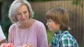 Happy senior couple having dinner with grandchildren, sweet childhood memories HD Footage