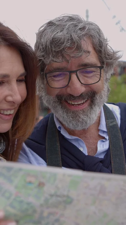 Happy senior couple looking a map while sightseeing Barcelona city. Stock Footage 280503692