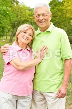 Happy senior couple in the park Stock Photos