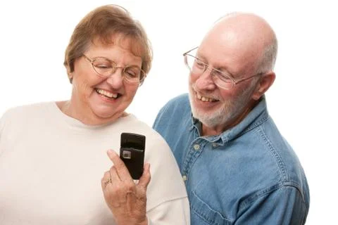Happy Senior Couple Using Cell Phone Isolated on a White Background. Stock Photos