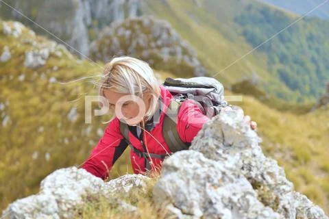 Happy senior female hiker enjoying outdoor activity Stock Photos