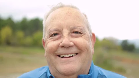 Happy senior man smiling on camera outdoor in the woods - Elderly healthy Stock Footage 163847677