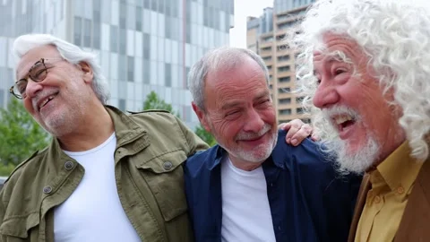 Happy senior men having fun together walking outdoors Stock Footage 275711260