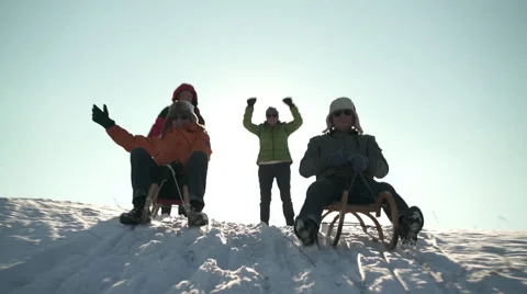 Happy senior men with winter caps tobogganing Stock Footage 59591598