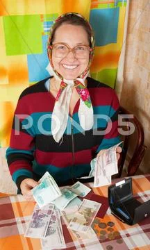 Happy senior woman with money Stock Photos