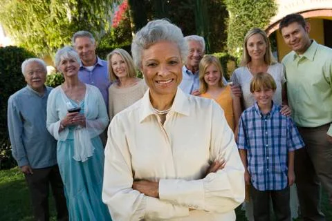 Happy Senior Woman Standing With Hands Folded Stock Photos