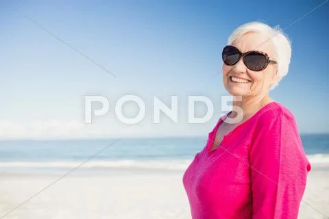 Happy Senior Woman With Sunglasses Smiling