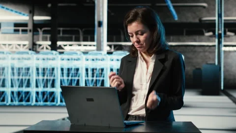 Happy server hub engineer dancing in celebration after fixing system errors Stockbeeldmateriaal 329327143