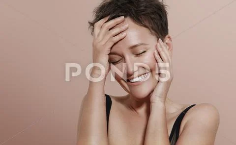 Happy shiny smiling young woman with short haircut Stock Photos