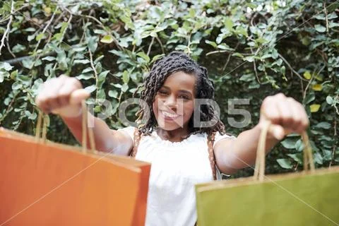 Happy shopaholic after shopping Stock Photos