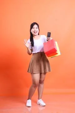 Happy shopper waves hello Stock Photos
