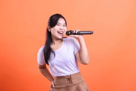 Happy Singer Performing With Microphone Stock Photos