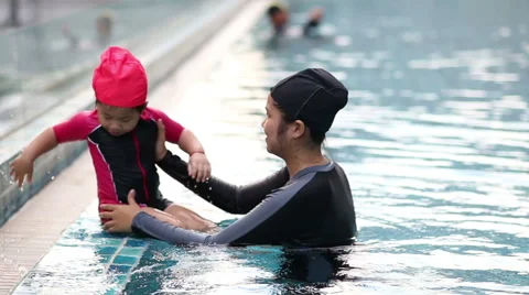 Happy single mom family playing in swimming pool. Stock Footage