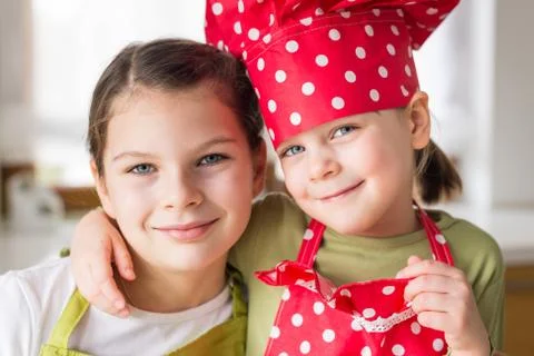 Happy sisters cooking together 스톡 사진