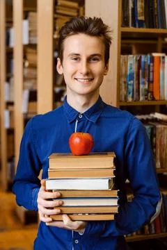 Happy smart student prepares for classes. Stock Photos