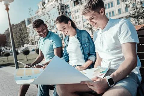 Happy smart students working on a project Stock Photos