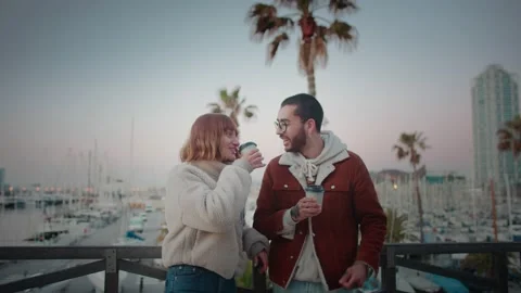 Happy smiling affectionate young couple enjoying communication drinking coffee Video stock 136672769