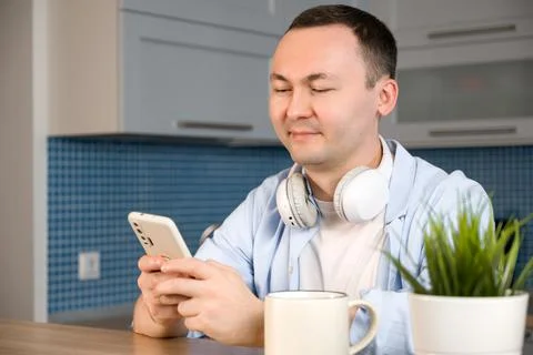 Happy smiling asiam man using smartphone for online shopping or communication Stock Photos