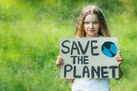 Happy smiling child looking to camera holding a colorful save planet ecology  Stock Photos