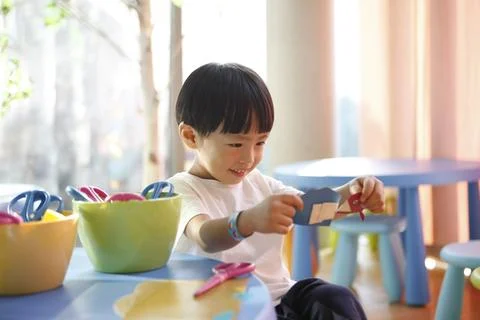 Happy smiling children learning creative art education and play Stock Photos