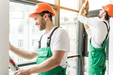 Happy smiling constructors working together Stock Photos