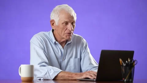 Happy smiling elderly man talking on webcam in video chat and waving hand hello Stock Footage 213283950