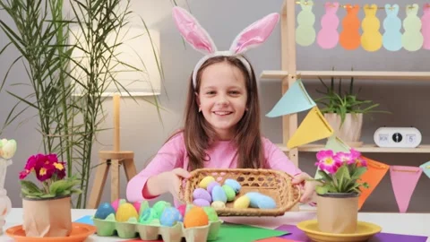 Happy smiling enjoyable cheerful brown haired little girl wearing bunny ears Stock Footage 293239834