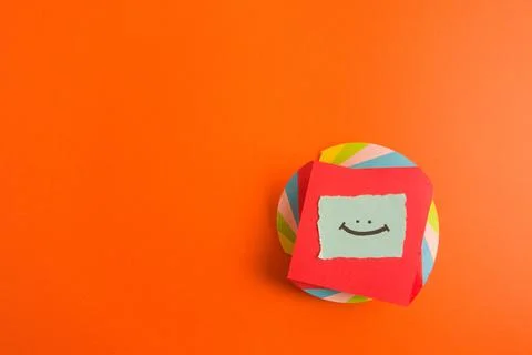 Happy smiling face hand drawn on colorful background Stock Photos
