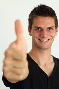 Happy smiling man doing two thumbs up Stock Photos