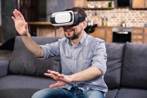 Happy smiling man testing VR device Stock Photos