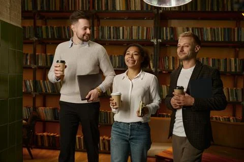 Happy smiling office worker creative team with coffee Stock Photos