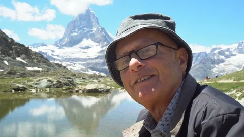 Happy Smiling Old Man Telling Stories Of Life in Mountains - Model Released Stock Footage 93340111
