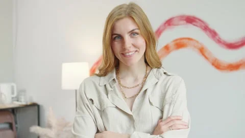 Happy smiling red-haired confident female professional looking at camera at Stock Footage 275582125