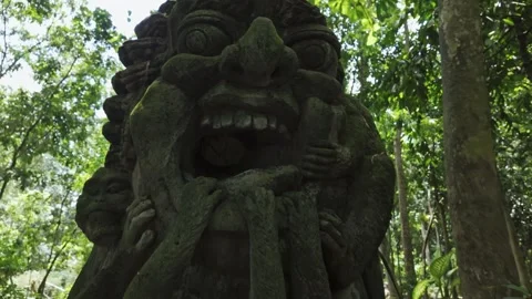 Happy smiling statue in the Monkey Forest. Ubud, Bali, Indonesia. Stock Footage 271567163