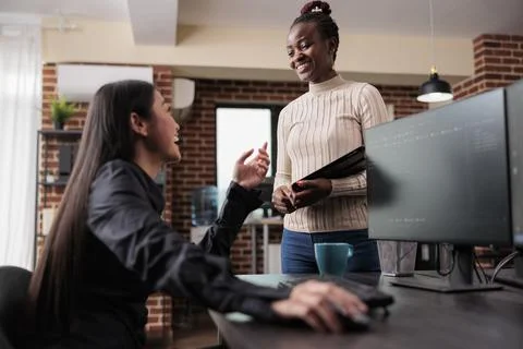 Happy smiling tech developing company workers laughing Stock Photos