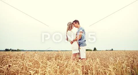 Happy smiling young hippie couple outdoors Stock Photos