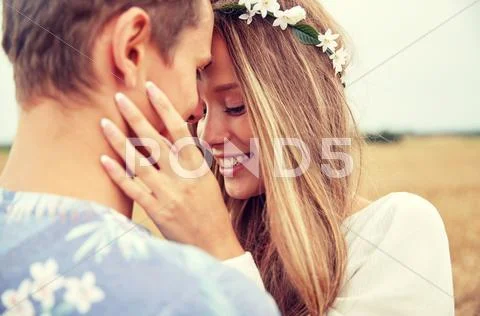 Happy smiling young hippie couple outdoors Stock Photos