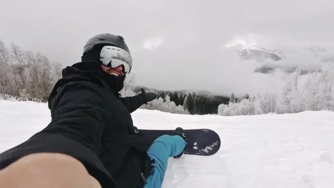 Happy snowboarder taking selfie send greetings outdoors on snowy mountain, .. Stock Footage 342963926