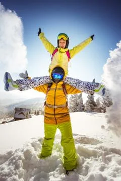 Happy snowboarders having fun on the mountain Stock Photos